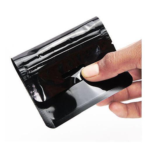Shiny black three side seal pouch with zipper